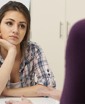 Teenage Girl Suffering From Depression Visiting Counsellor
